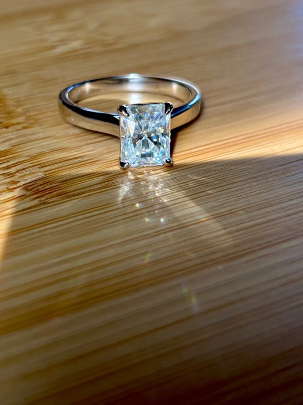 A certified 3ct radiant Moissanite solitaire in solid sterling silver and 18k!